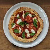 Margherita Pizza · Fresh tomatoes, basil, and Buffalo mozzarella.