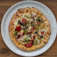 Loaded Veggie Pizza · Red onion, Mama Lil’s, green olives, artichokes, roasted mushrooms, and garlic oil base.