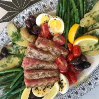 Tuna Nicoise · Classic salad from Nice, France. Fresh yellowfin tuna seared rare. The tuna is served atop a...