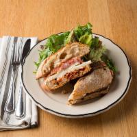 The Prosciutto Sandwich · 24-month black label parma-prosciutto, mozzarella, and tomato-balsamic spread.