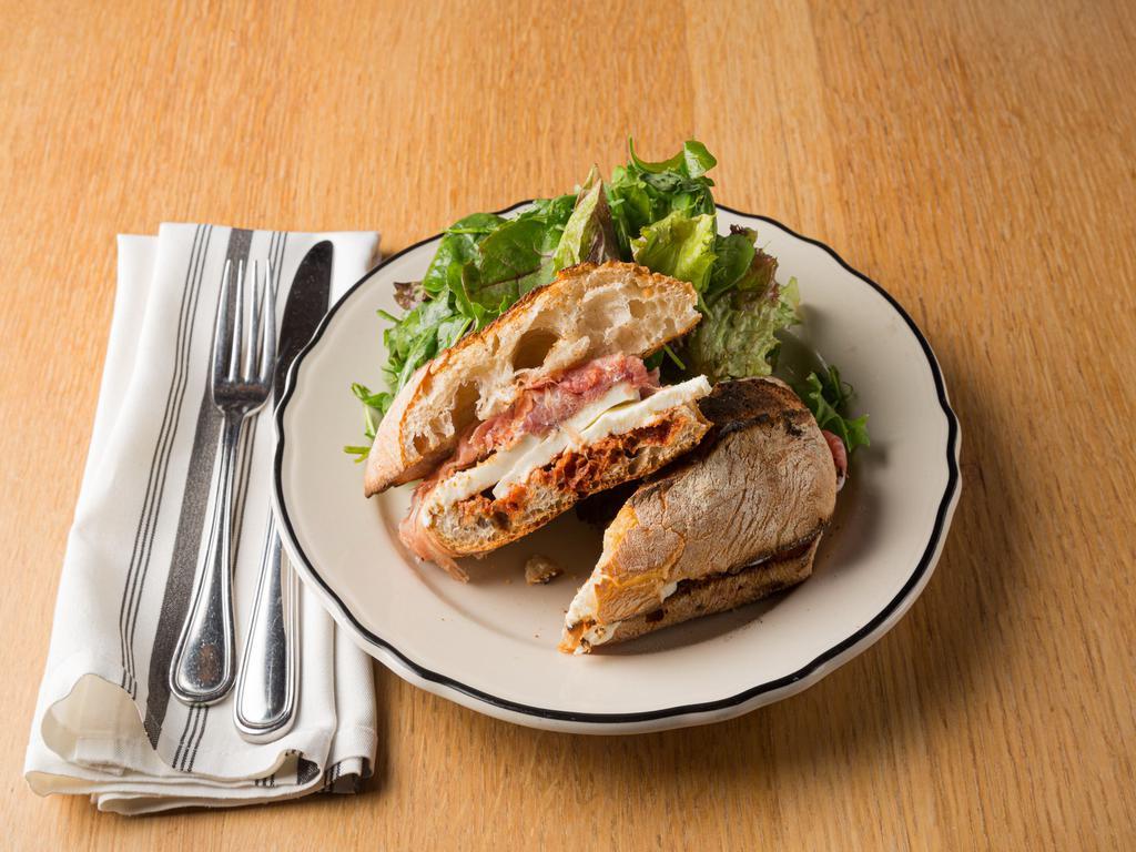 The Prosciutto Sandwich · 24-month black label parma-prosciutto, mozzarella, and tomato-balsamic spread.