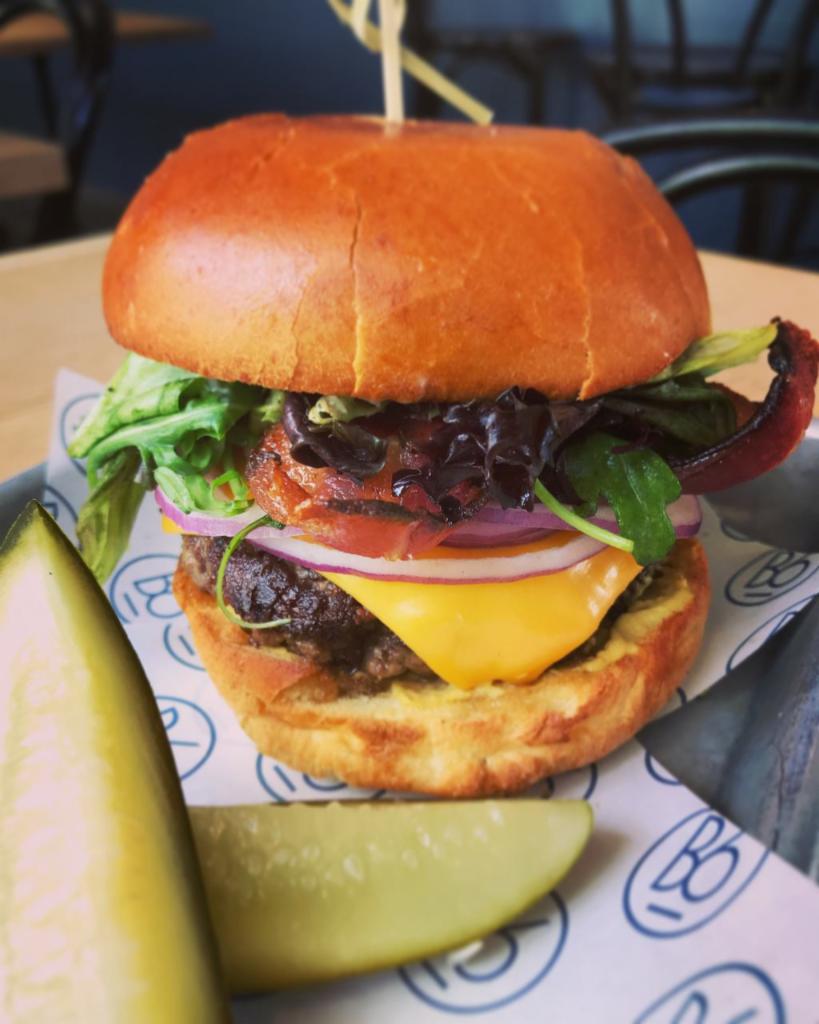 Our Classic · House-ground Demkota Ranch Brisket and Chuck, blended with ground 18 month Prosciutto di Parma.  Each 6 oz. burger comes on a toasted brioche bun with 2 Kosher dill pickle spears.
