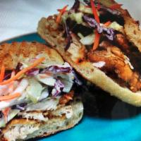 Fried Chicken Breast Sandwich Lunch · Topped with spicy pineapple coleslaw on a sourdough torpedo roll.