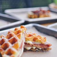 The Cristo Waffle · Waffle sandwich with smoked turkey, blackforest ham, melty white American cheese, and blackb...