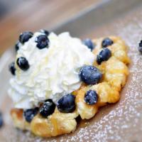 Southern Belle Waffle · Fresh blueberries, lemon curd, and our house made whipped cream on our golden Liege waffle.