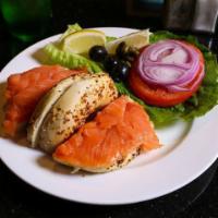Nova Scotia · Low salt and mild smoked salmon. Served with lettuce, tomato, onion, olives, capers, lemon a...