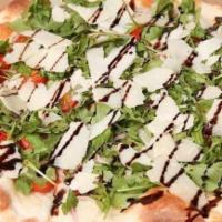 Arugula Pizza · Arugula, red onions & grape tomatoes, topped with Reggiano cheese & a balsamic reduction dre...