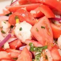 Tomato Salad · Garden tomatoes, onions, garlic, basil, parsley, fresh mozzarella & extra virgin olive oil d...