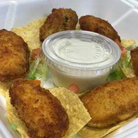 Jalapeno Poppers · Mild jalapeno poppers stuffed with cheese, then dipped in a special butter, served with sour cream sauce.