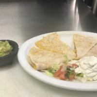 Quesadilla · A grilled flour tortilla with cheese garnish with lettuce, tomatoes and sour cream.