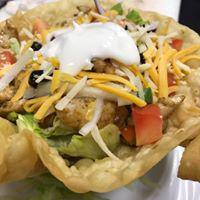 Fajita Salad  · Fresh lettuce in a crisp tortilla shell. Topped with Fajita veggies (grilled onions and bell peppers), Beans, tomatoes, cheese, olives and sour cream sauce.