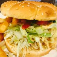 Peruvian Chicken Sandwich · Shredded chicken breast with lettuce, tomatoes, mayo, mustard, ketchup and fries inside. Ser...