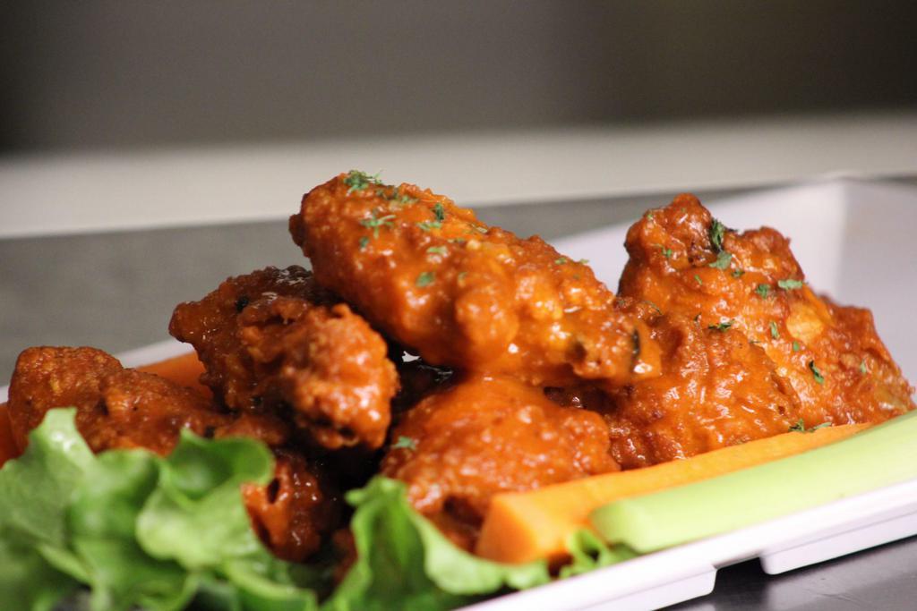 Chicken Wings · Breaded chicken wings with choice of sauce; Pendragon IPA buffalo, Firestone DBA BBQ or sweet & spicy house sauce. Served with ranch or bleu cheese and carrots and celery sticks. 