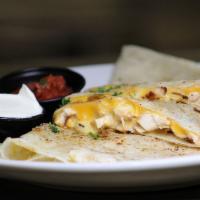 Chicken Quesadilla · Grilled chicken breast, mixed shredded cheese and queso.  Served with salsa and sour cream