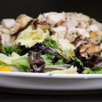 Legends Own · Field greens, bowtie pasta, whole sliced chicken breast, mandarin oranges, grapes and almond...