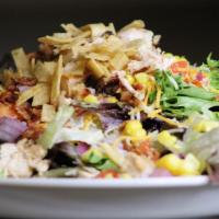 Sweet N Smokey Chicken  · Crisp field greens, chicken breast, red onions, tomatoes, hickory smoked bacon, corn, tortil...
