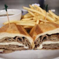 French Dip Sandwich · 9Thin slices of slow smoked tri-tip topped with sliced provolone & swiss on a toasted French...
