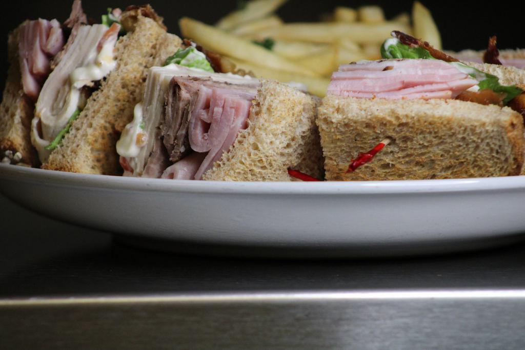 Midstate Club Sandwich · A triple decker on wheat piled high with smoked tri-tip, oven roasted turkey, hickory smoked bacon, honey baked ham, lettuce, tomato, red onion and avocado.