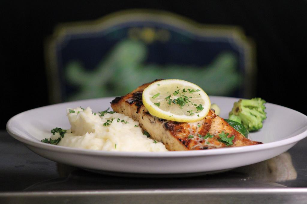 Grilled salmon  · Citrus crime sauce, seasonal vegetables, and choice of side. 