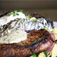 Ribeye · 12oz Hand-Cut Ribeye with tarragon compound butter seasonal vegetables and your choice of side