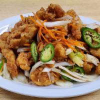 Salt & Pepper Chicken · Deep fried chunks of chicken stir fried with green/white onion, and carrots with special sal...