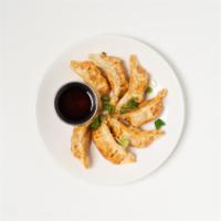 9. Gyoza (7) · crispy chicken dumplings with house soy sauce vinaigrette.