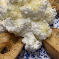 Ricotta di Pecora · Fresh sheep's milk ricotta cheese served with garlic crostini.
