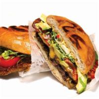 Torta milanesa  · Torta sandwich with milanesa beef meat, beans, cheese, tomatoes, lettuce & onion. 