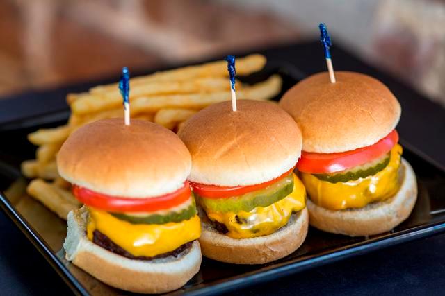 Beef Sliders · Three traditional style sliders, ultra-premium beef, a blend of USDA Choice American Black Angus Chuck and Short Rib, with melted American cheese, tomato, and pickle. Served with a side item. 