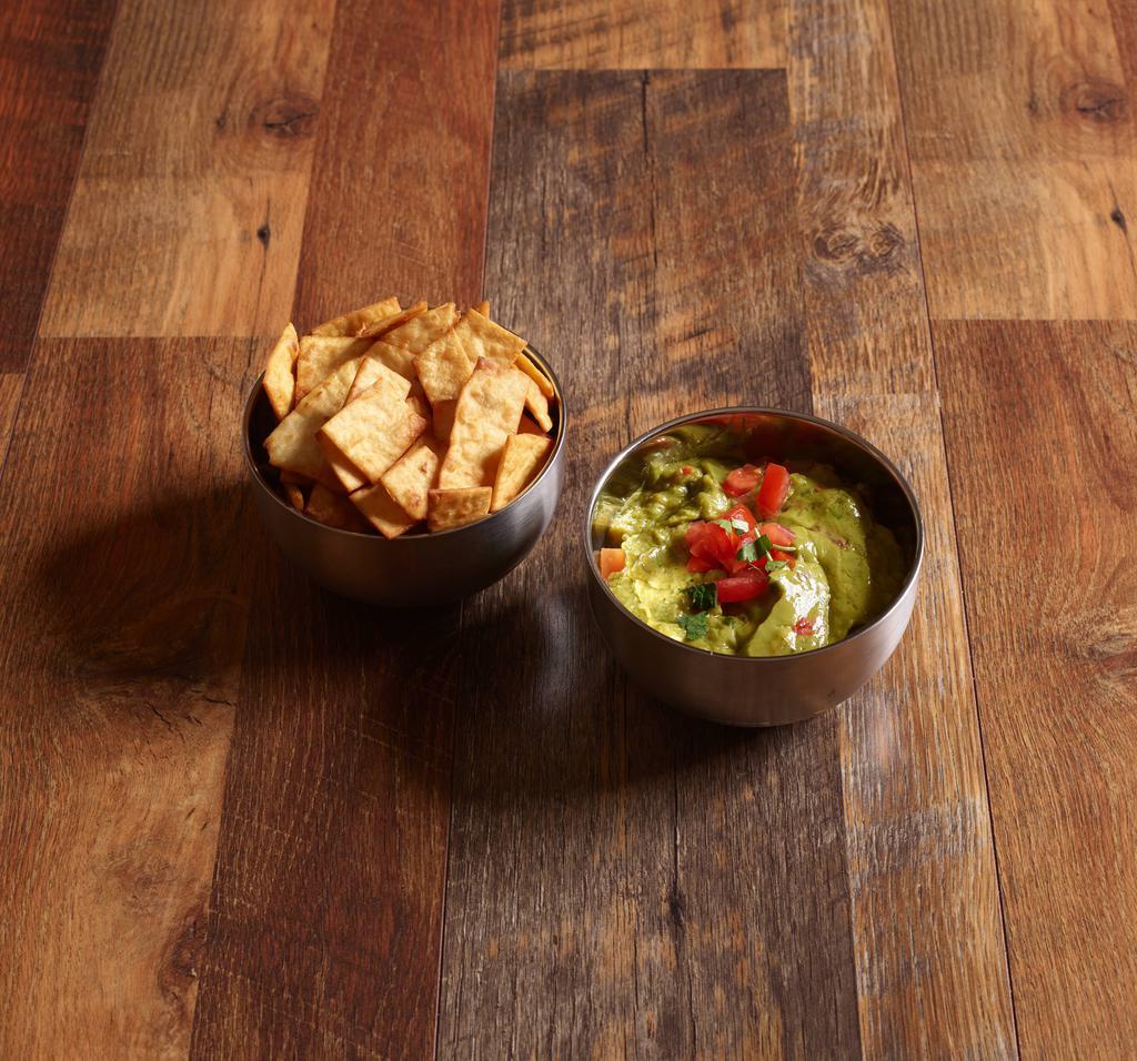Guacamole and Chips · Homemade flour tortilla chips and freshly made guacamole.