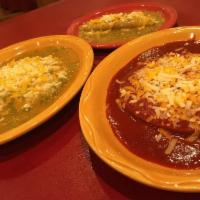 5.  Ground Beef Enchilada Plate · Three rolled or flat beef enchiladas smothered in choice of chile sauce. Served with beans, ...