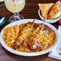 6. Chile Relleno Plate · Two Anaheim Peppers stuffed Monterrey jack Cheese smothered in red or green chile sauce. Ser...