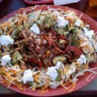 Fajita Salad · Marinated chicken or Steak beef, grilled with fresh onion, bell peppers and tomatoes, placed...