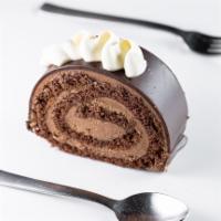 Swiss Chocolate Almond Roll Cake  · Decadent chocolate cake filled with creamy chocolate ganache with a hint of almond!