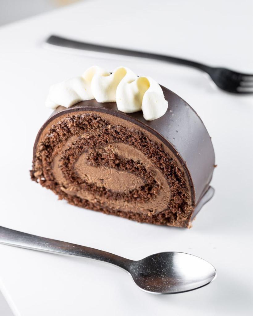 Swiss Chocolate Almond Roll Cake  · Decadent chocolate cake filled with creamy chocolate ganache with a hint of almond!