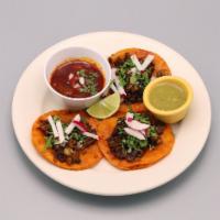 Tacos de Birria · Set of 3  birria tacos (tradicional beef stew Mexican style) topped with onion and cilantro ...