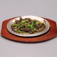 Fajitas  · Chicken, bistec, shrimp or mixed. Topped with sauteed onions and peppers. Served with rice a...