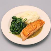 Salmon Ranchero · Grilled salmon served with mashed potatoes and spinach, molcajete sauce.
