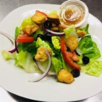 Garden Salad · Romaine lettuce, tomato, green peppers, red onions, olives and croutons.