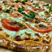 Margarita Pizza · Roma tomato, fresh basil, mozzarella and garlic sauce. Dick's suggestion: add meatball, mush...