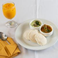 Iddly · 2 pieces. Steamed rice and lentil cakes. Served with sambar and coconut chutney.