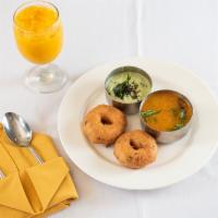 Medhu Vada · Fried lentil donuts served with sambar and coconut chutney.