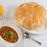 Channa Batura · Large poultry bread served with chickpeas curry.