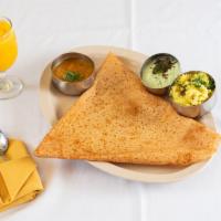 Mysore Masala Dosa · Crepe layered with chutney, potatoes, onions and cashew filling. Served with sambar and coco...