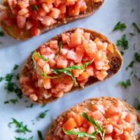 Bruschetta  · Tomato and basil on grilled bread.
