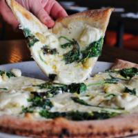 Popeye Pizza · Mozzarella, spinach, ricotta, roasted garlic and lemon zest. (no sauce)