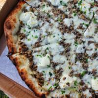 Shroom Pizza  · Finely chopped mushrooms, fresh ricotta, bel paese cheese, truffle oil and chives.