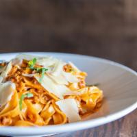 Bolo  · Fettucine, veal, beef and pork bolognese with Parmigiano.