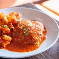 Eggplant Parm · Layers of eggplant smothered in tomato sauce and mozzarella. Served with rigatoni and pomodo...