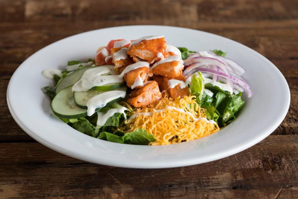 Dr. Buffalo Chicken Salad · Crisp romaine, tomatoes, cucumbers, cheddar, red onion, Buffalo tenders and ranch dressing. Low carb.